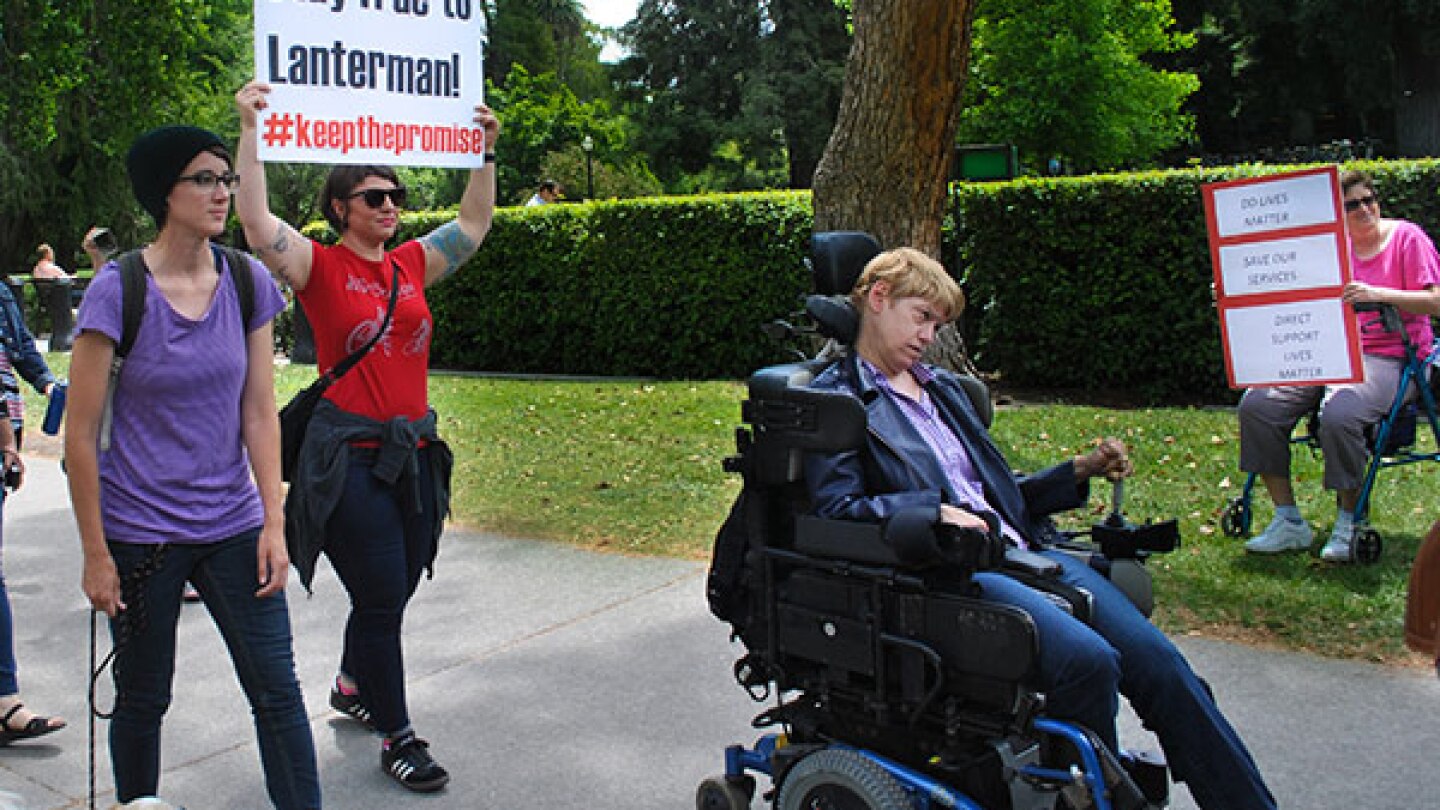 Disability rights advocates march to the State Capitol in Sacramento on May 18, 2015, urging lawmakers to increase funding for services and programs for individuals with developmental disabilities.