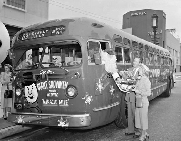 Santa Claus arrives in a bus in the city's Miracle Mile district, circa 1955. Courtesy of the Metro Transportation Library and Archive. Used under a Creative Commons license.