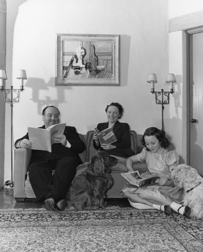 Alfred Hitchcock with his wife Alma Reville and their daughter Patricia Hitchcock at their California home, ca. 1941.