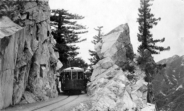 A Pacific Electric Railway car travels through the San Gabriel Mountains on one of the sections leading to and from Mount Lowe. | Courtesy of the Los Angeles Public Library