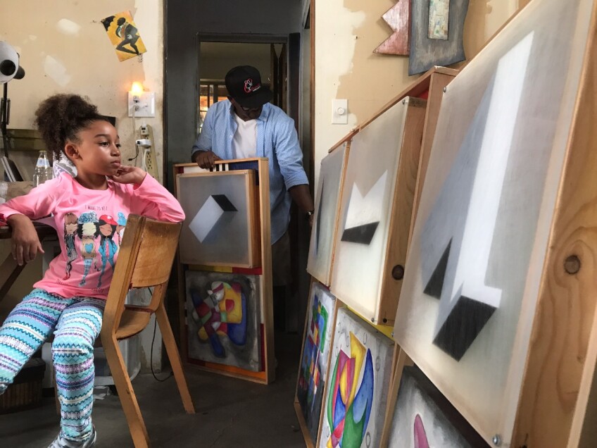 Chephren Rasika uncovering some of RoHo's works with his daughter | Benedek Mohay