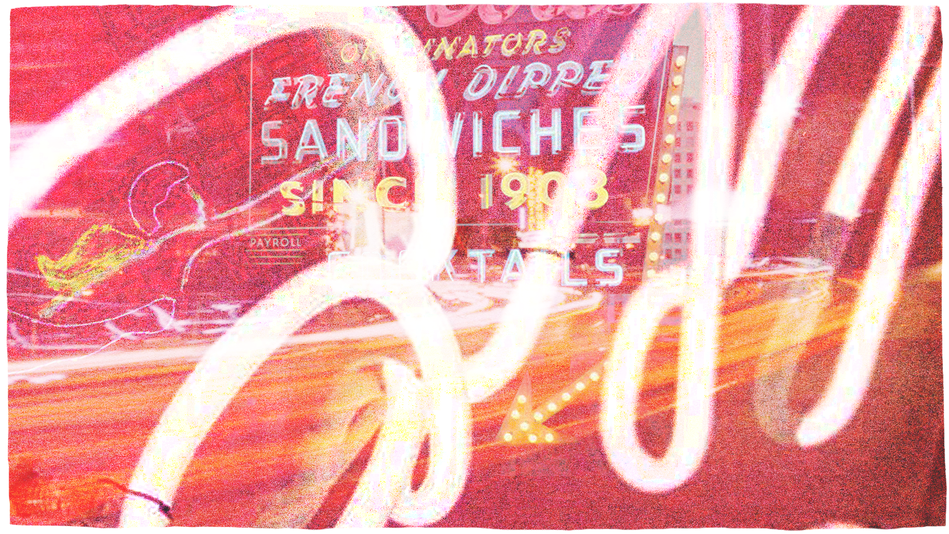 A close up of a neon sign. Some words like "French dipped sandwiches since 1908" are visible.