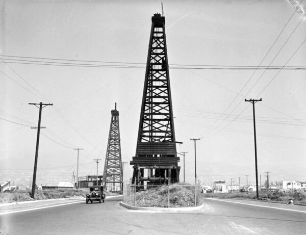 An oil well once stood in the middle of La Cienega Boulvevard. Courtesy of the USC Libraries - California Historical Society Collection.
