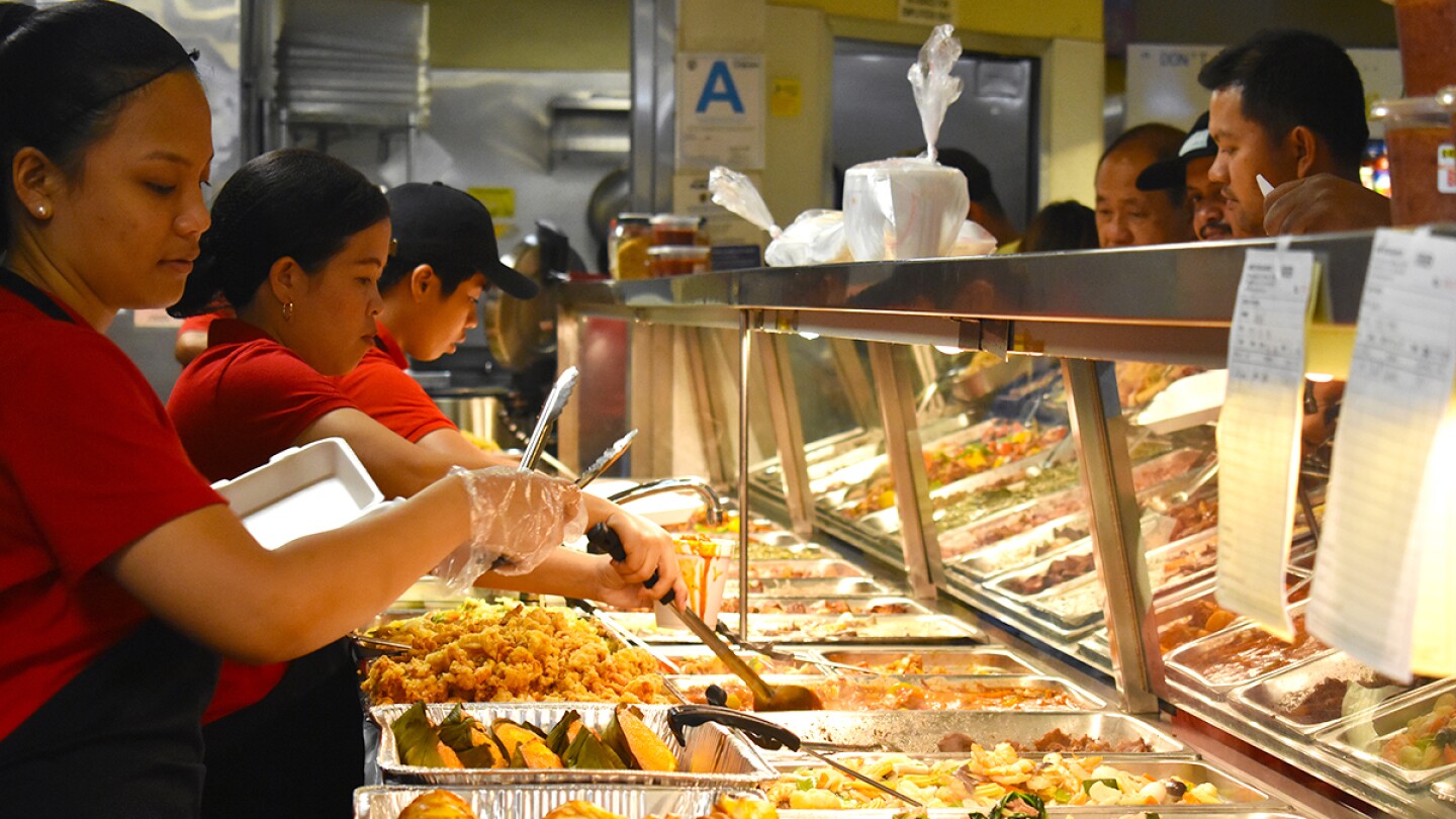 Arko Foods Market's workers serving customers in the turo-turo section. | Jacqueline Lee
