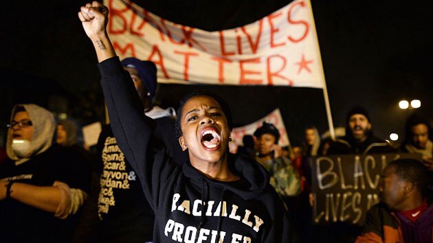 Demonstrators shout slogans during a march in St. Louis, Missouri, on November 23, 2014 to protest the death of 18-year-old Michael Brown. Photo by: JEWEL SAMAD/AFP/Getty Images