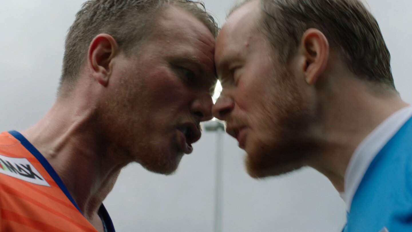 Two men push their faces against each other in a heated spat.| "Home Ground: Damn Alesund"
