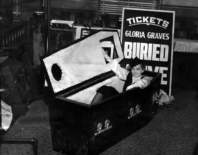 A girl and her coffin. Gloria Graves, the “buried alive girl,” brought her crypt to court to prove she wasn’t in violation of a city ordinance. Photograph courtesy of Herald-Examiner Collection, Los Angeles Public Library