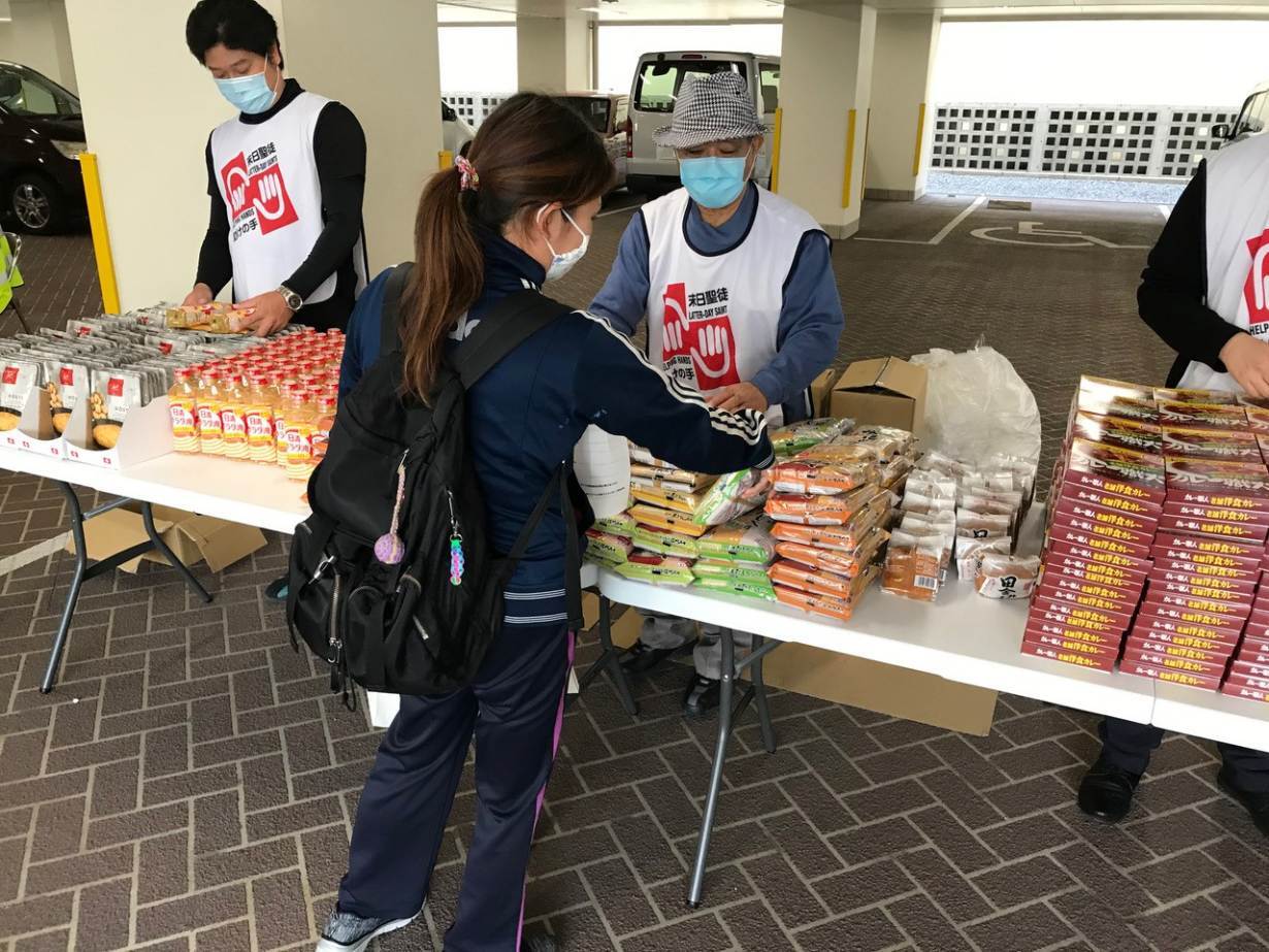 Volunteers handle food donations in Tokyo, Japan.