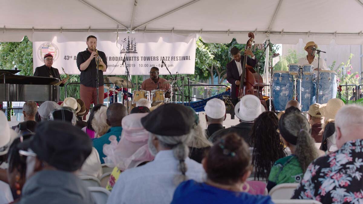 A student from the Jazz Mentorship Program performs at the Simon Rodia Jazz Festival at the Watts Towers Arts Center. | Still from "Southland Sessions" " Watts Towers Festivals"