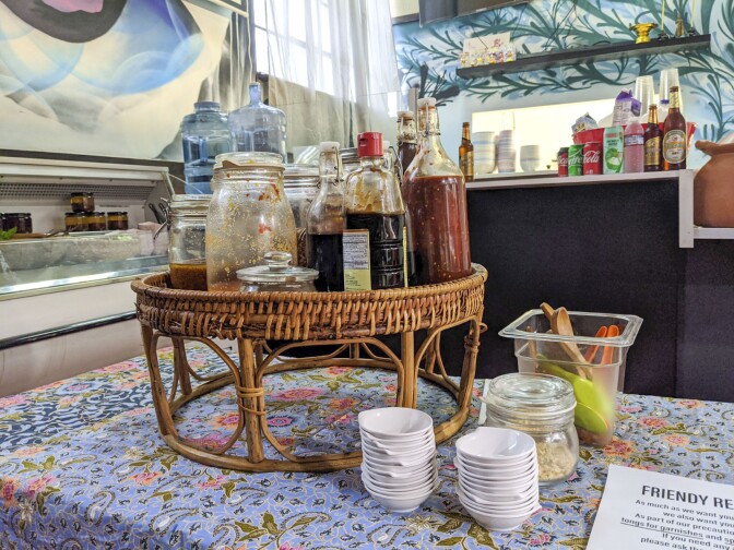 A tray of spices and sauces used in and paired with Lao dishes.