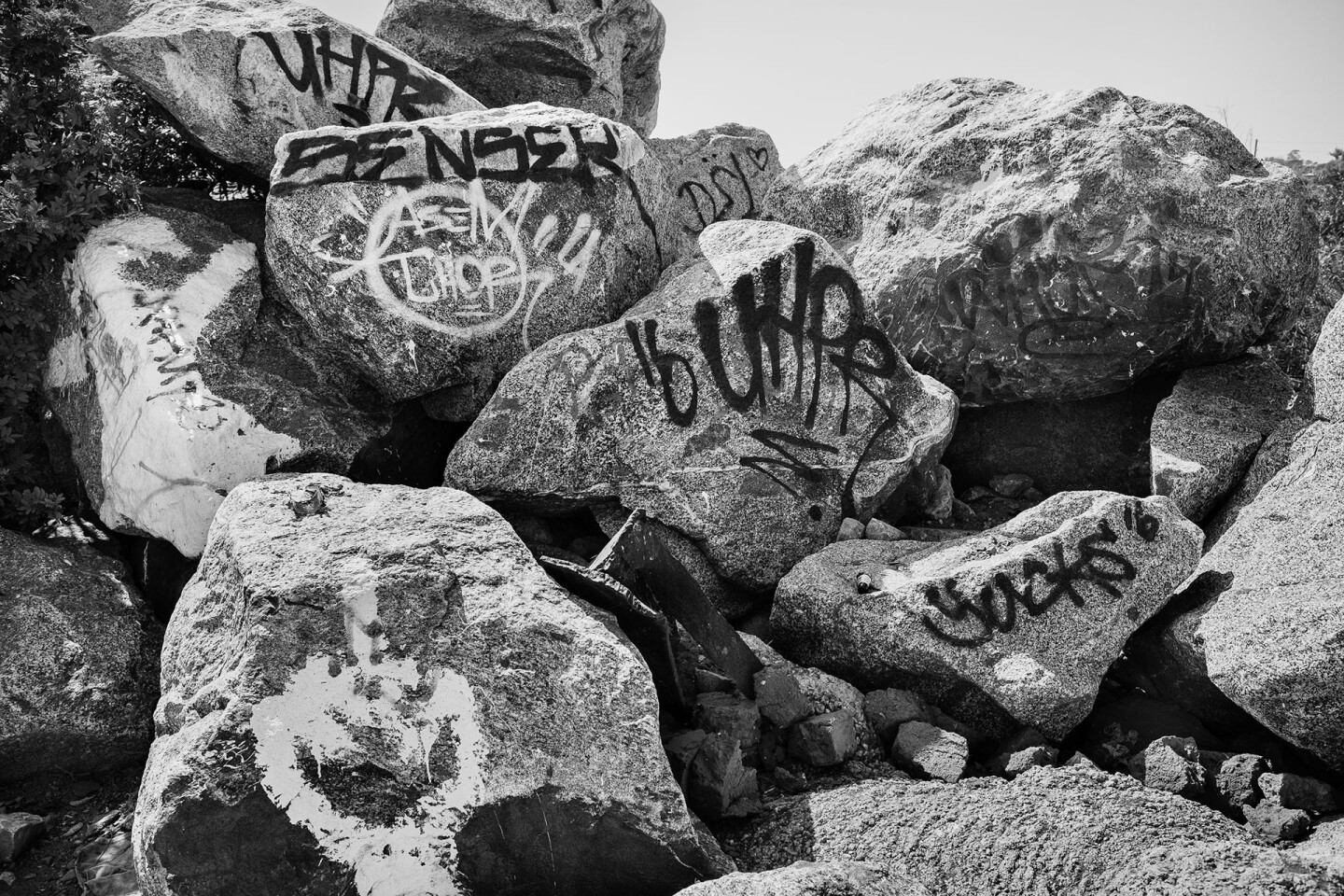 A large pile of boulders displays the tags of some of the individuals who have spent time out at the Bowtie over the years | Photo by Bear Guerra