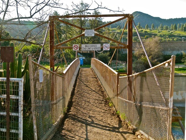 Cross horse bridge at your risk, reads the sign. This path leads into Griffith Park.