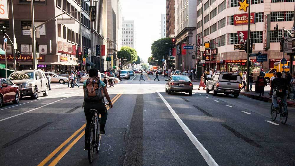 A biker riding through downtown Los Angeles. | Taylor Fitz-Gibbon
