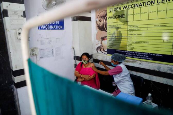 A woman receives Bharat Biotech's coronavirus disease (COVID-19) vaccine called COVAXIN at a vaccination center, in New Delhi, India, April 5, 2021.