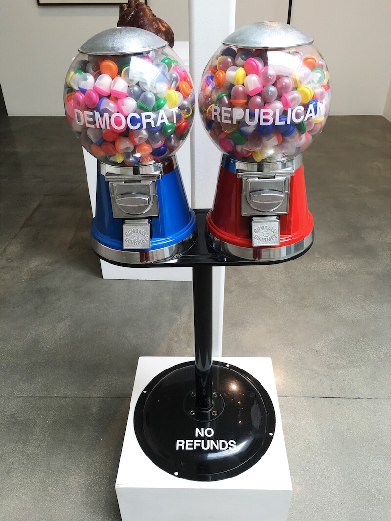 Native American artist Gerald Clarke Jr. uses a gumball machine to explore the electoral process in his sculpture "Democracy for Sale."
