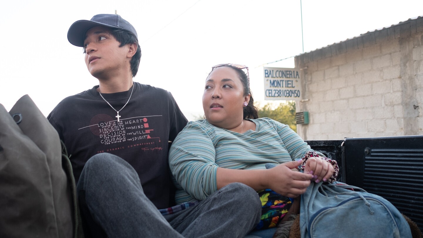 Armando Espitia as Iván, Michelle Rodríguez as Sandra in "I Carry You With Me."