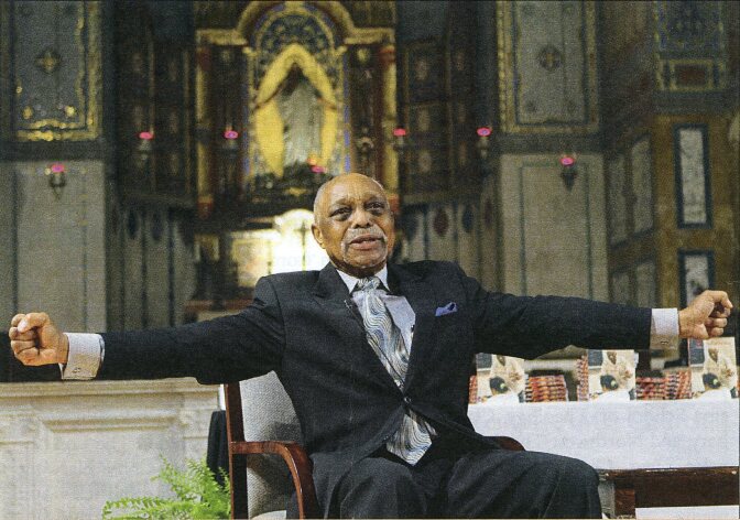 Rev. Cecil “Chip” Murray extending his arms out. | Courtesy of Center for Religion and Civic Culture