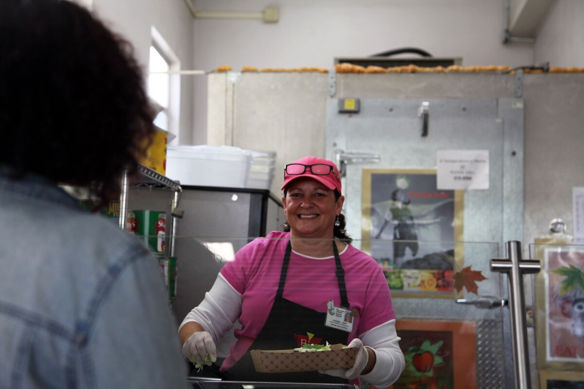 Deborah Luman serving salad