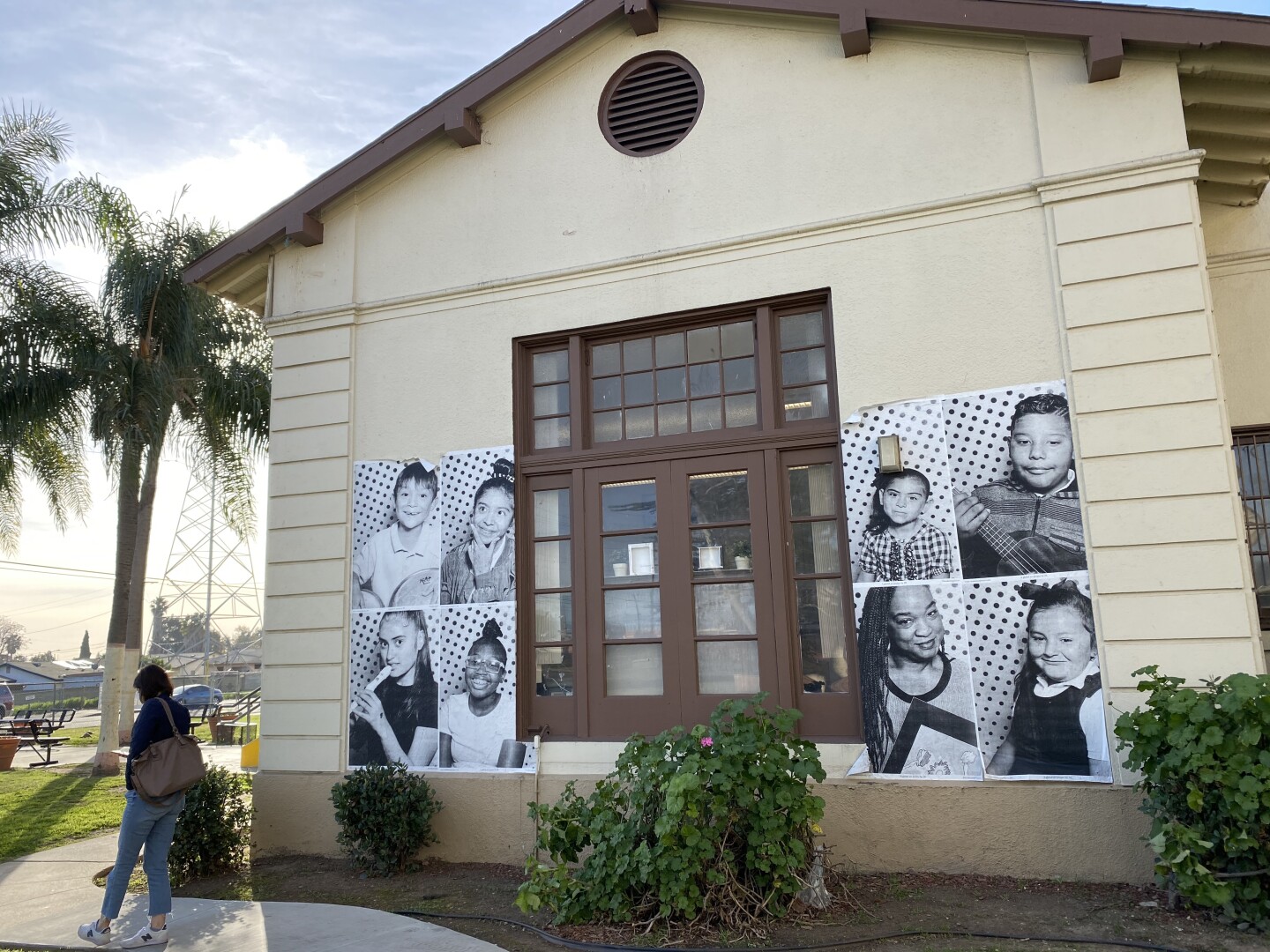 Posters of children and faculty rest on the side of McKinley K-8 School of Integrated Arts.