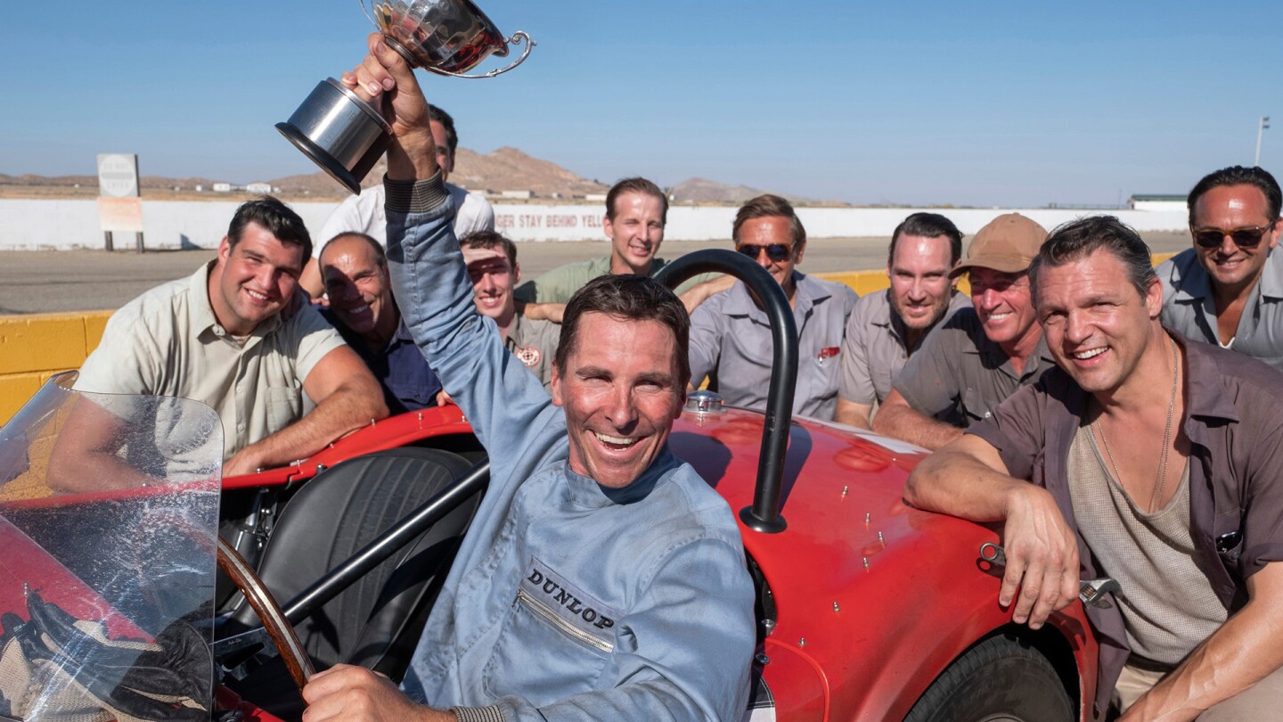 Christian Bale raises a trophy in the film, "Ford v Ferreri"