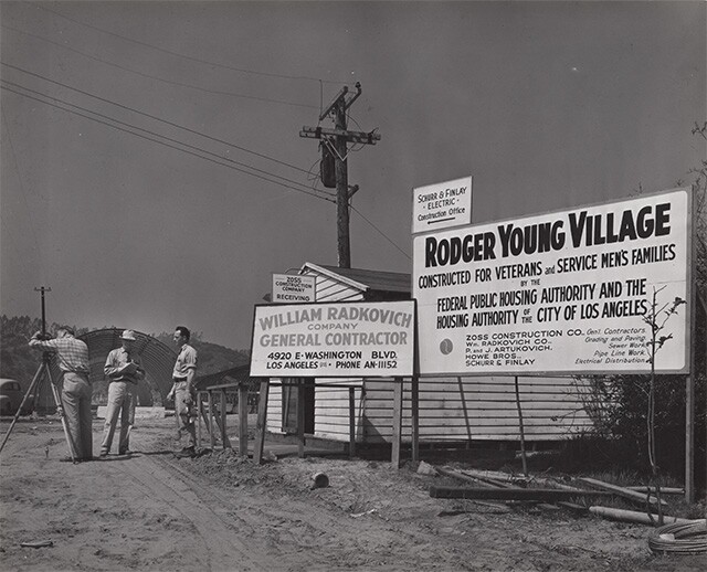 Contractors sign and workers at Roger Young Village | Housing Authority of the City of Los Angeles