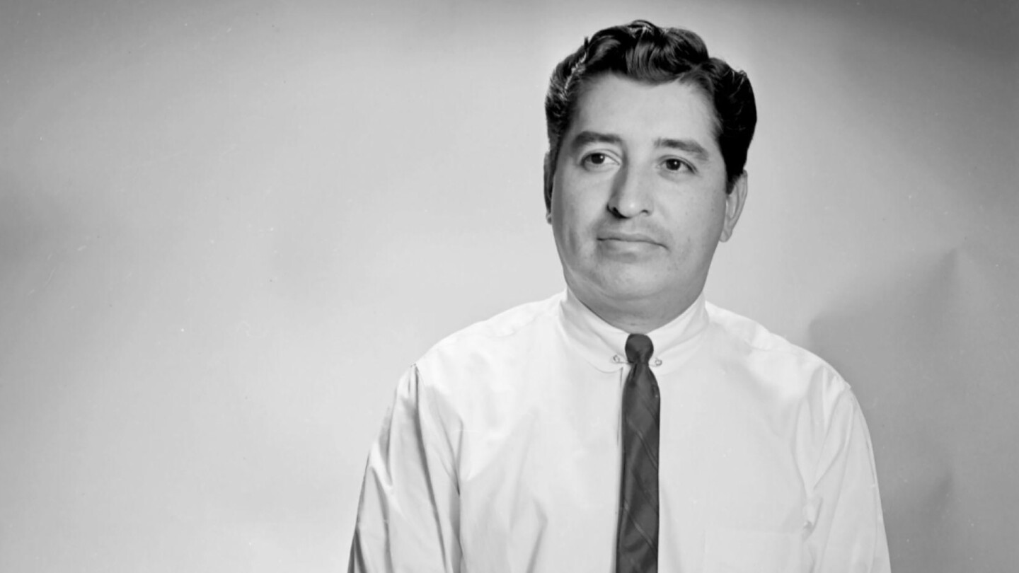 Ruben Salazar, sitting, from "Ruben Salazar: Man in the Middle"