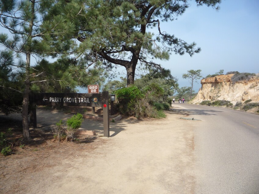 A sign points to the Parry Grove Trail at Torrey Pines State Natural Reserve.