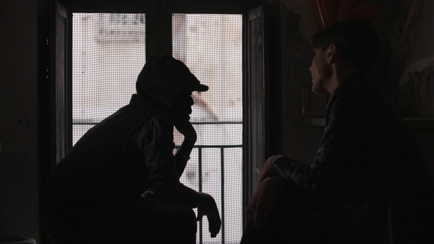 Silhouette of a man resting his head on his chin. | From "Foreign Correspondent: The New Mafia"