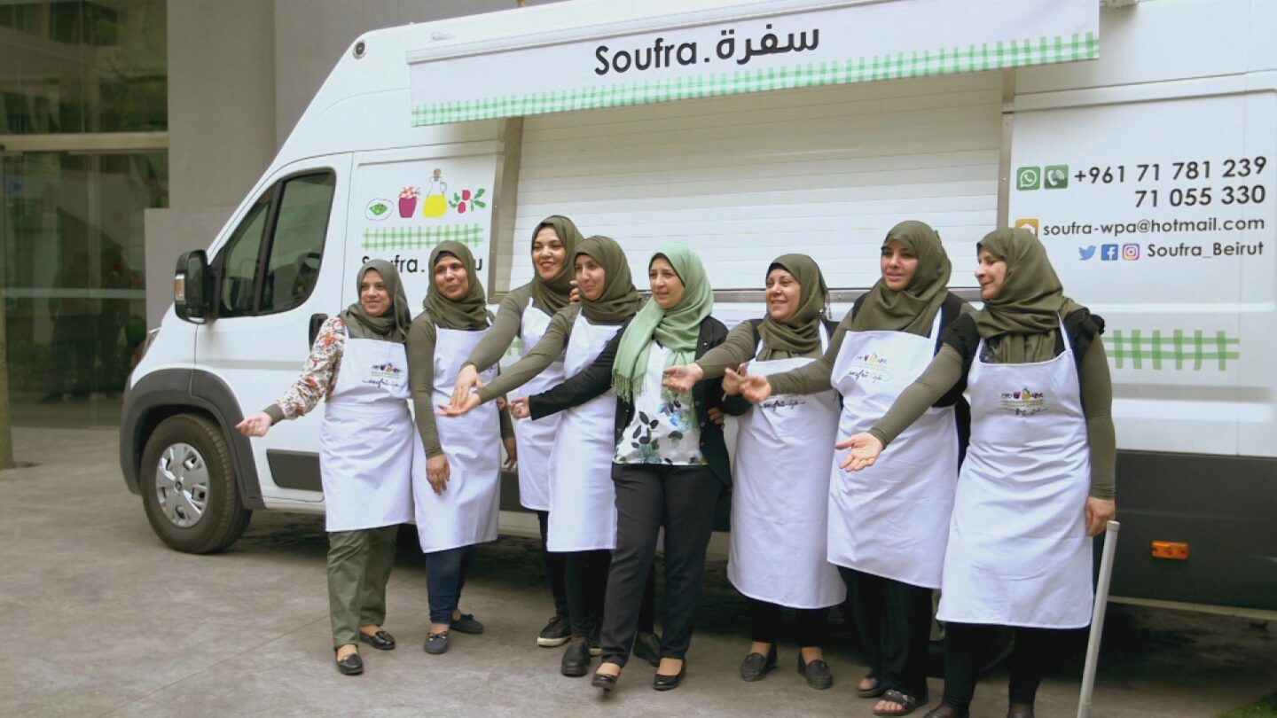 A group of Palestinian women pose in front of their food truck called "Soufra." | From "Link Voices: Soufra"