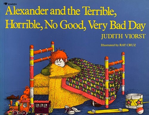 Book cover of “Alexander and the Terrible, Horrible, No Good, Very Bad Day” written by Judith Viorst and illustrated by Ray Cruz featuring an illustration of an angry-looking little boy lying on his bed. | Courtesy of Amy Monn
