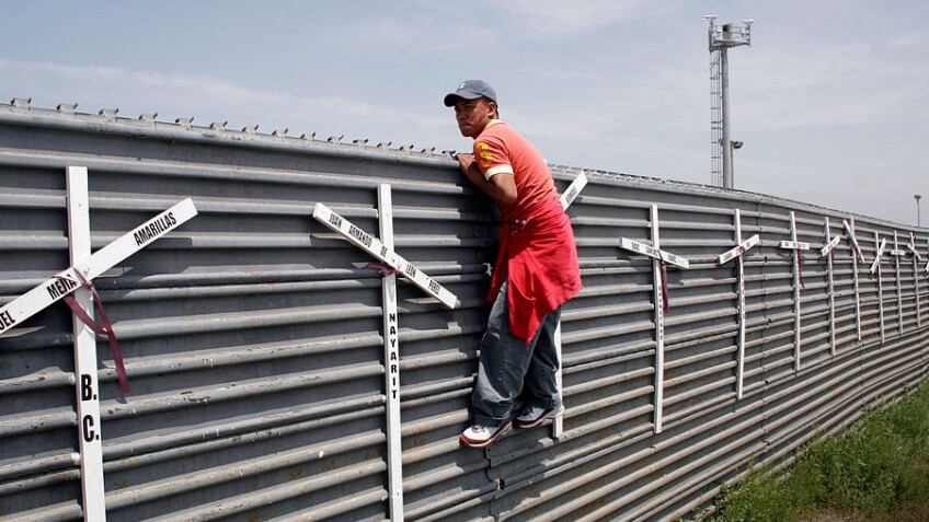 A wall lining the border in San Diego County | photo by Tomas Castelazo
