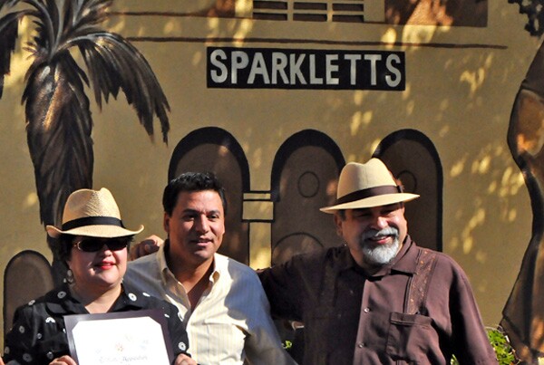 Debra Padilla of SPARC, Jose Huizar, Joe Bravo & Sparkletts logo at the unveiling of History of Highland Park mural, October 22, 2011 | Photo by KCET Departures