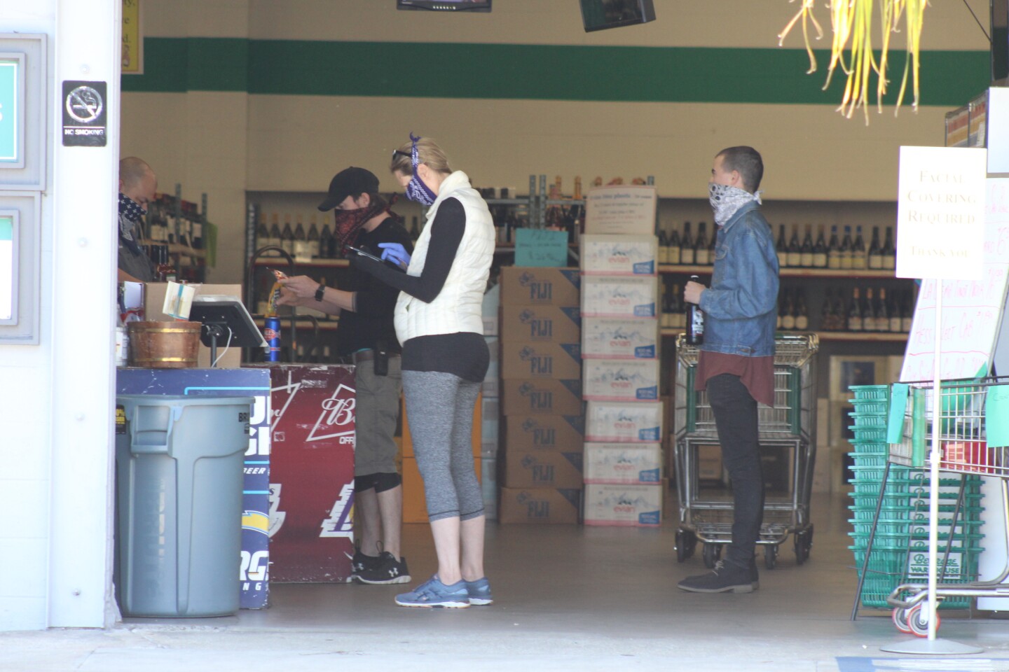 Customers check out at Beverage Warehouse | Karen Foshay