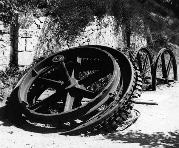 Shown here is a grip wheel, 9 feet in diameter, once part of the cable winding machinery located in the Echo Mountain cable house and used to pull the cable cars up and down the Incline portion of the railway. | Courtesy of the Los Angeles Public Library