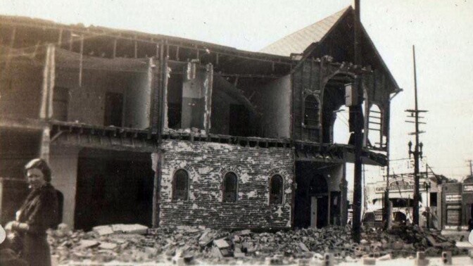 Woman next to rubble after 1933 quake