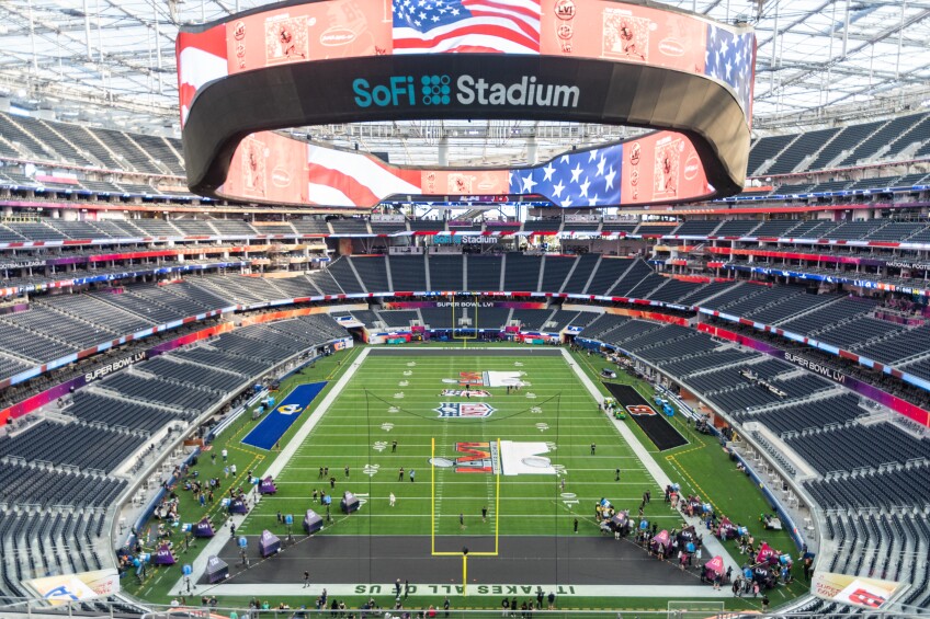 On the field for Super Bowl LVI at SoFi Stadium in Inglewood, preparations for the game are taking place.