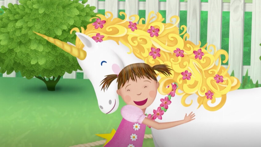 Cartoon of a little girl hugging a unicorn