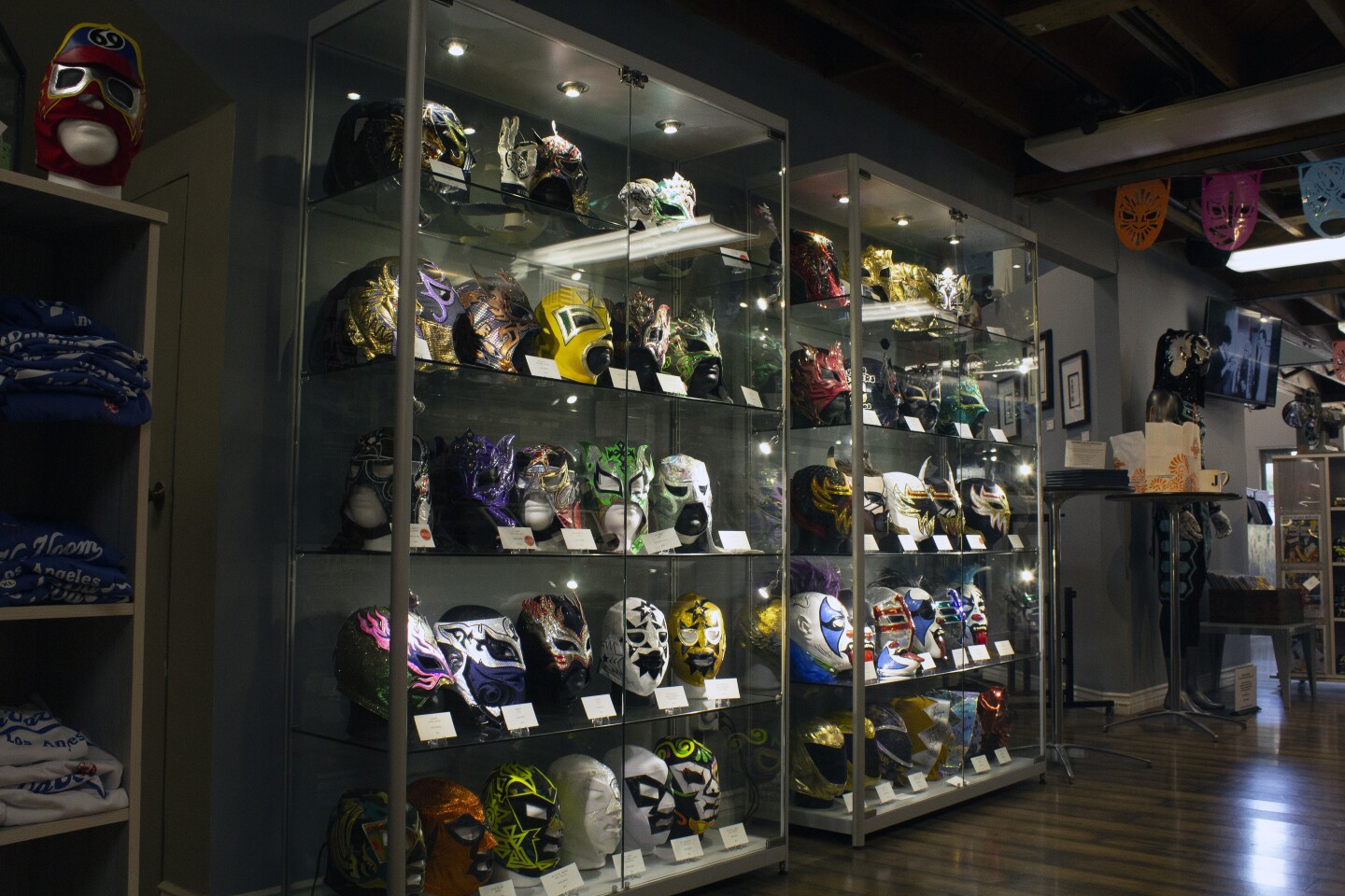 A display case of lucha libre masks at Republic of Lucha in South Pasadena.