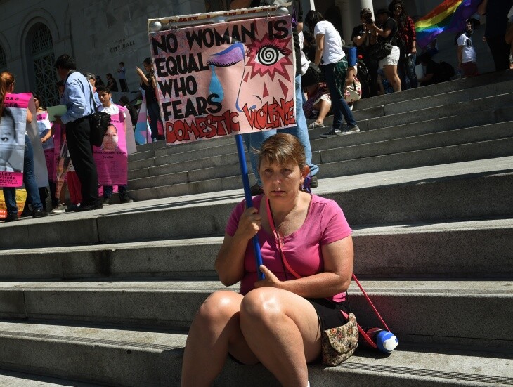 A woman at the 2015 International Women's Day march in L.A. | Mark Ralston/AFP via Getty Images