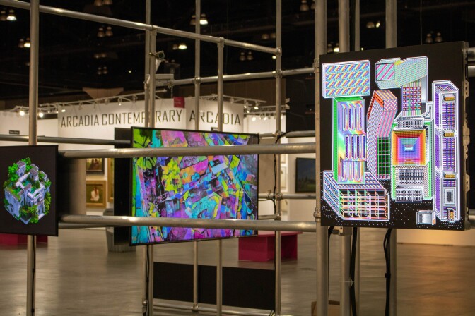 NFT art pieces flash on LED display screens mounted onto a metal piping structure.