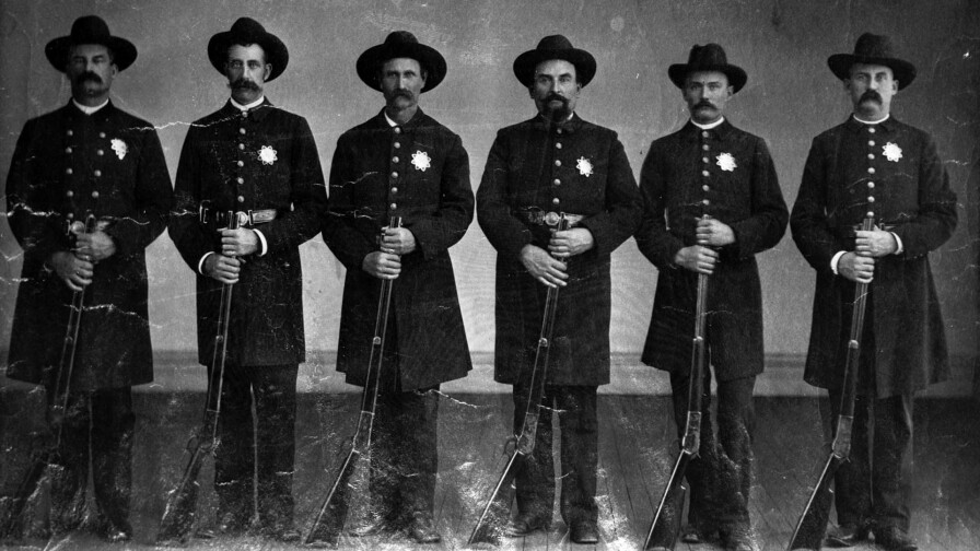 Portrait of the Los Angeles Police team, posing with rifles, 1890