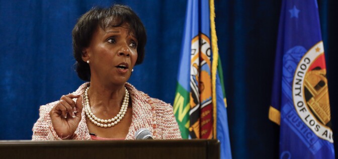 District Attorney Jackie Lacey at a podium, during a press conference