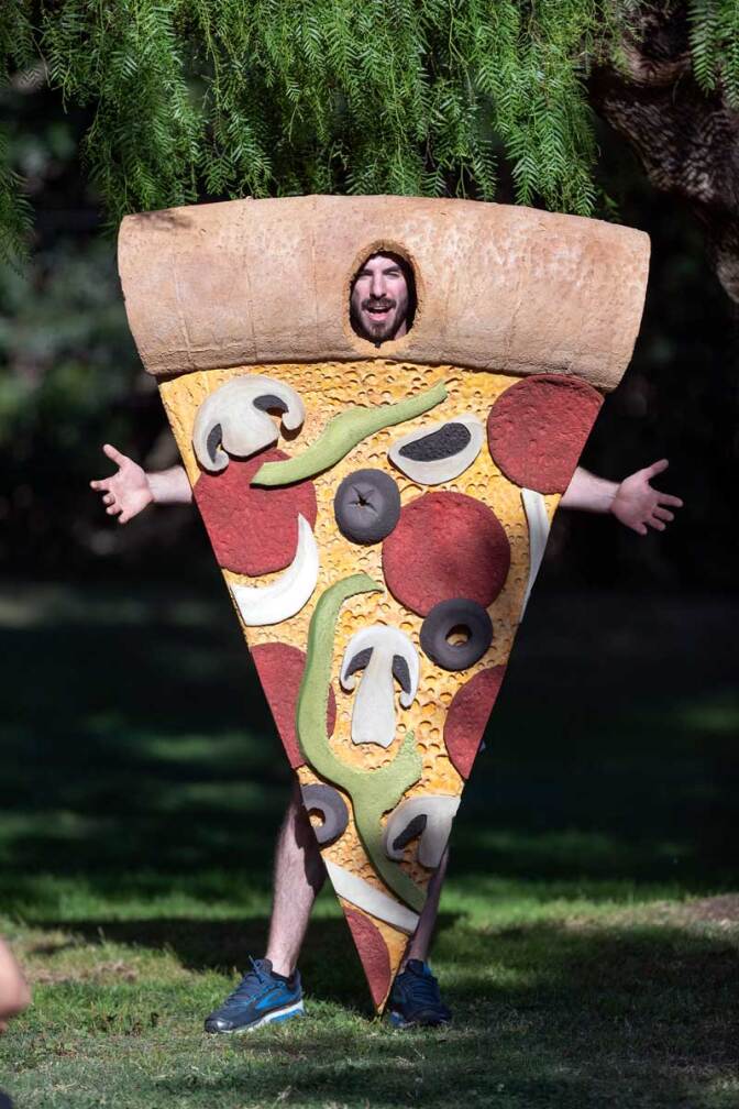 The pizza slice performs as part of the"The Food Group" by Ry Rocklen at Current:LA Food in Palms Park | Courtesy of the Department of Cultural Affairs