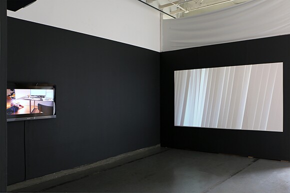 "Orientation" and "Rain," both 2014. Digital videos. "Priority Required," installation at 18th Street Arts Center Atrium Gallery, 2014. | Courtesy 18th Street Arts Center