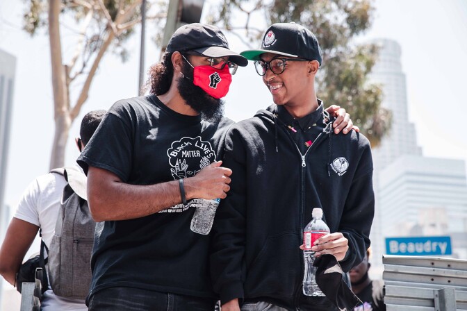 Joseph Williams of at Students Deserve and Core Leader with Black Lives Matter talks with Christian Wimberly, youth leader with the Brotherhood Crusade and the Brothers Sons Selves Coalition | Courtesy of Brothers, Sons, Selves