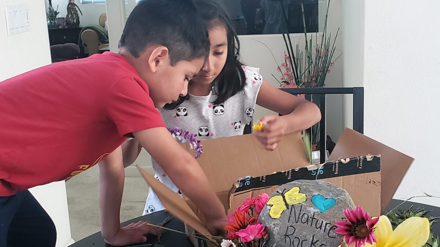 The Padilla children work on their nature-themed float.