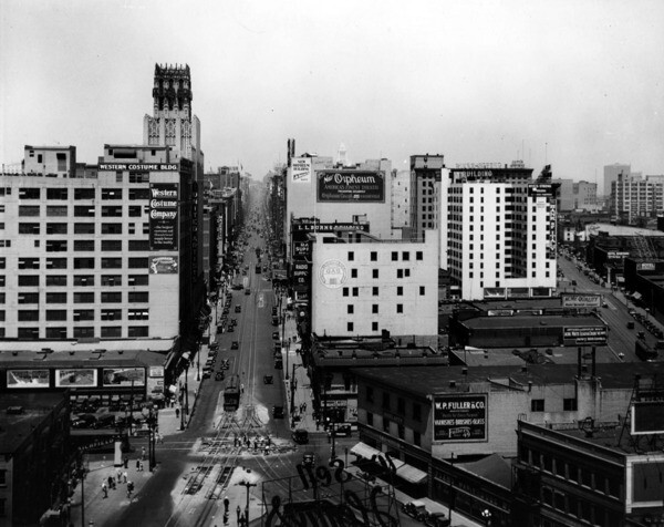 A view looking north up Broadway, showing the fork created by Broadway's 1919 and 1893 extensions at the bottom of the photo. Courtesy of the USC Libraries - Dick Whittington Photography Collection.