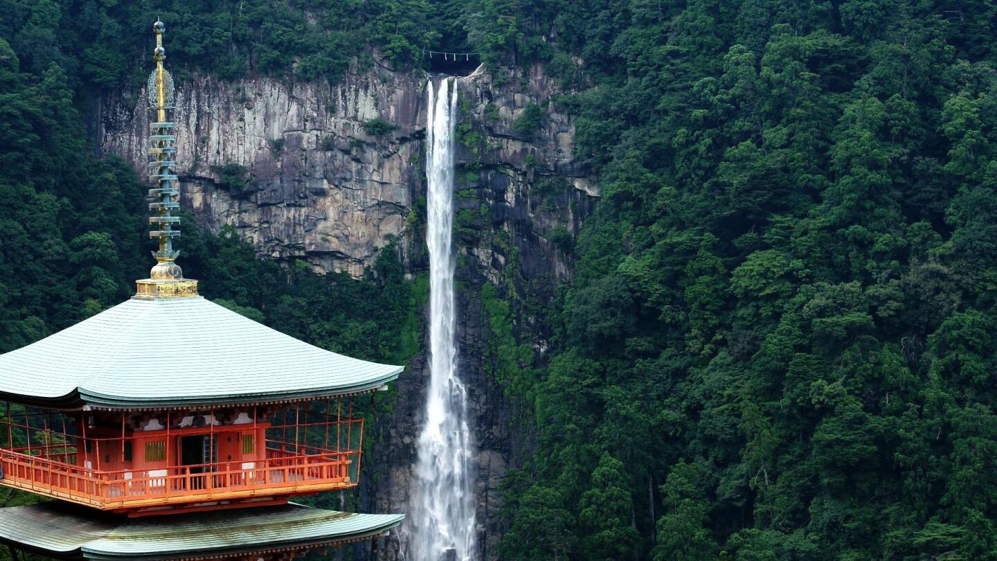 A landscape of a waterfall and Japanese temple. | From "Earth's Sacred Wonders: Closer to the Divine"