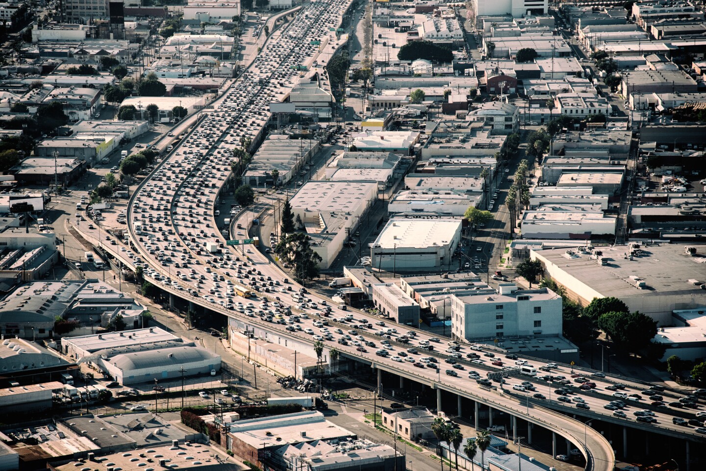 Heavy traffic during rush hour on Interstate 10 near downtown Los Angeles California during late afternoon.