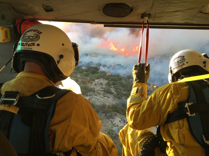 Two firefighters survey a fire from the sky. | Courtesy of Cliff Walters